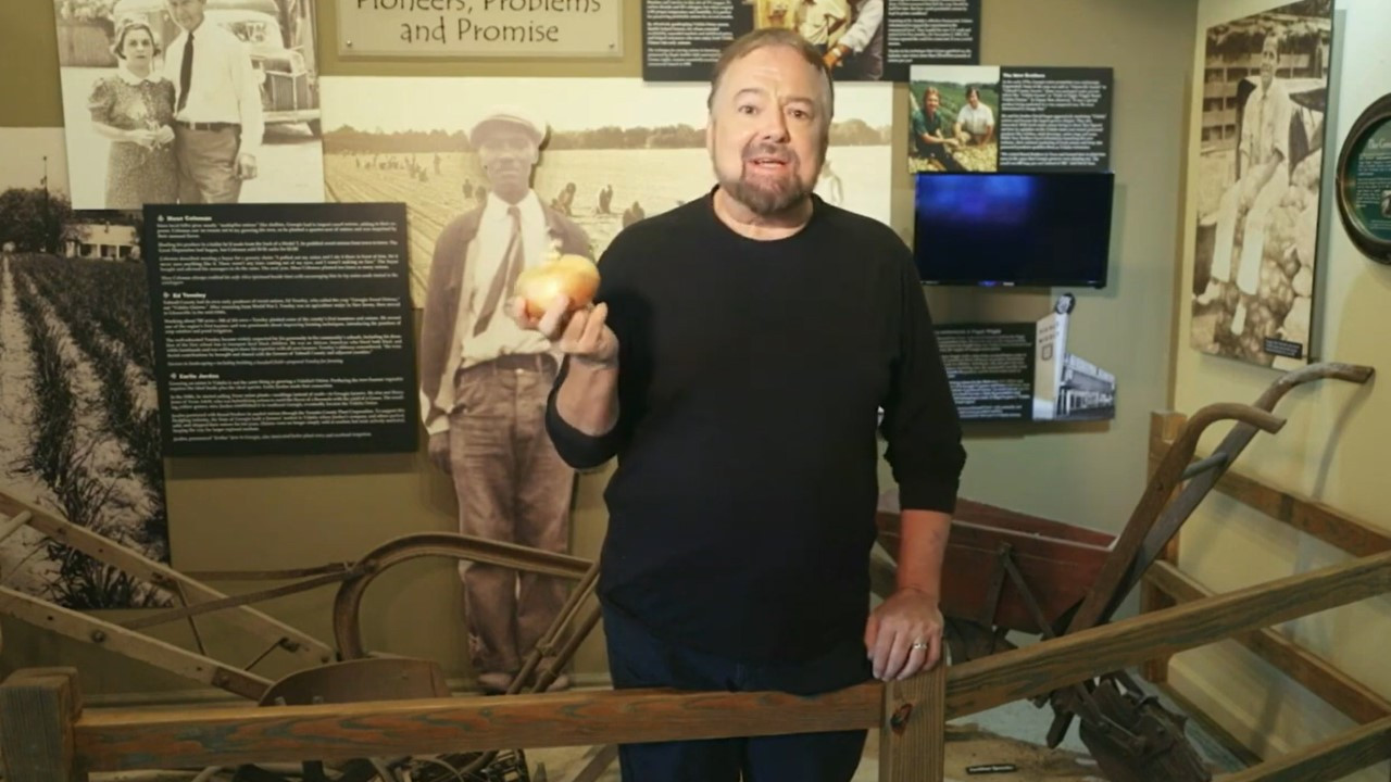 Chip Carter holding a Vidalia Onion