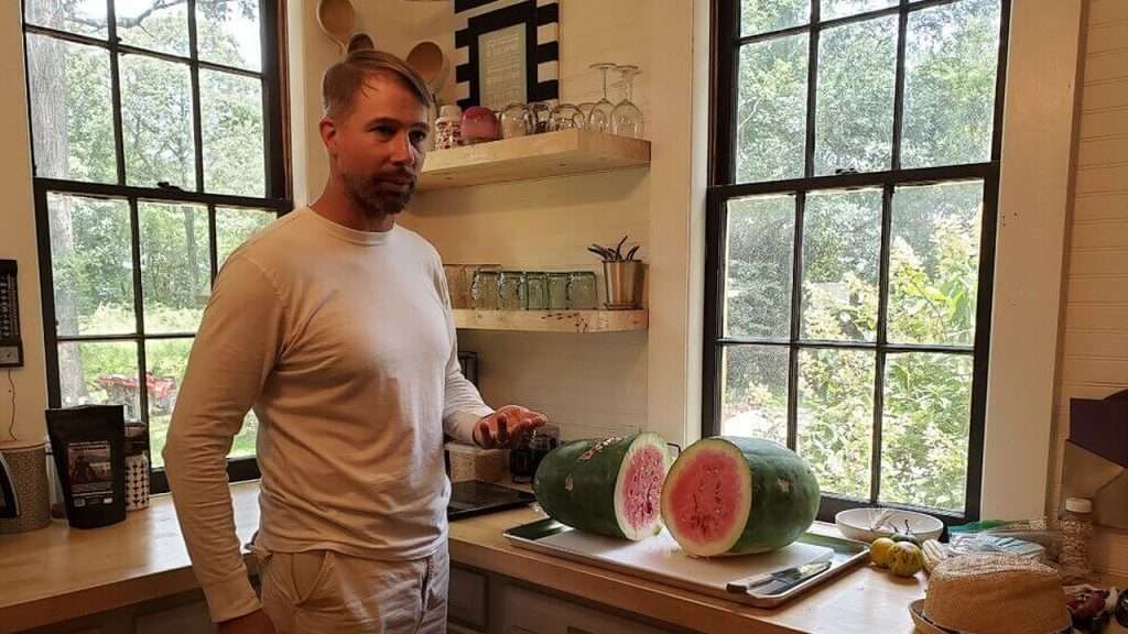 Nat Bradford with sliced watermelon.