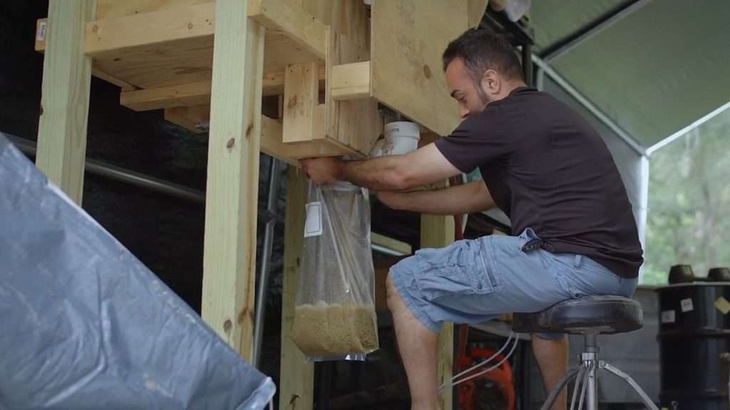 Joe filling mushroom block.