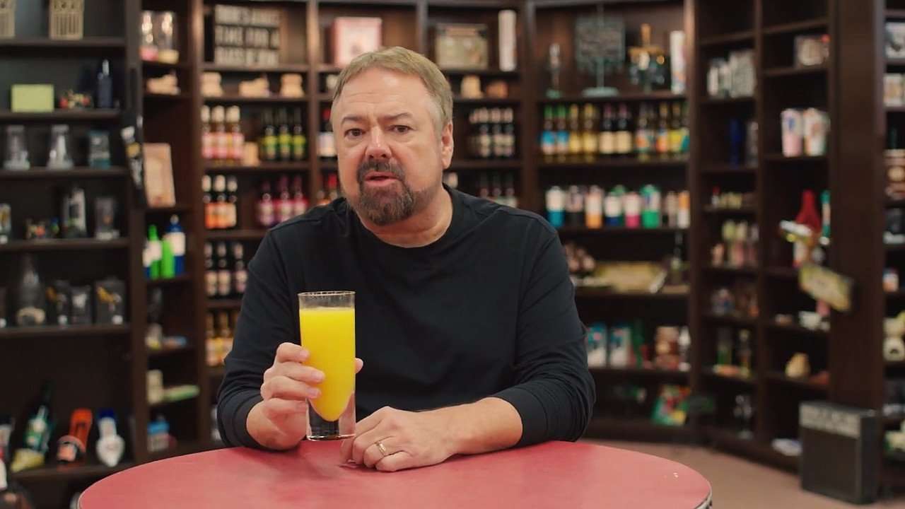 Chip with a glass of fresh orange juice.
