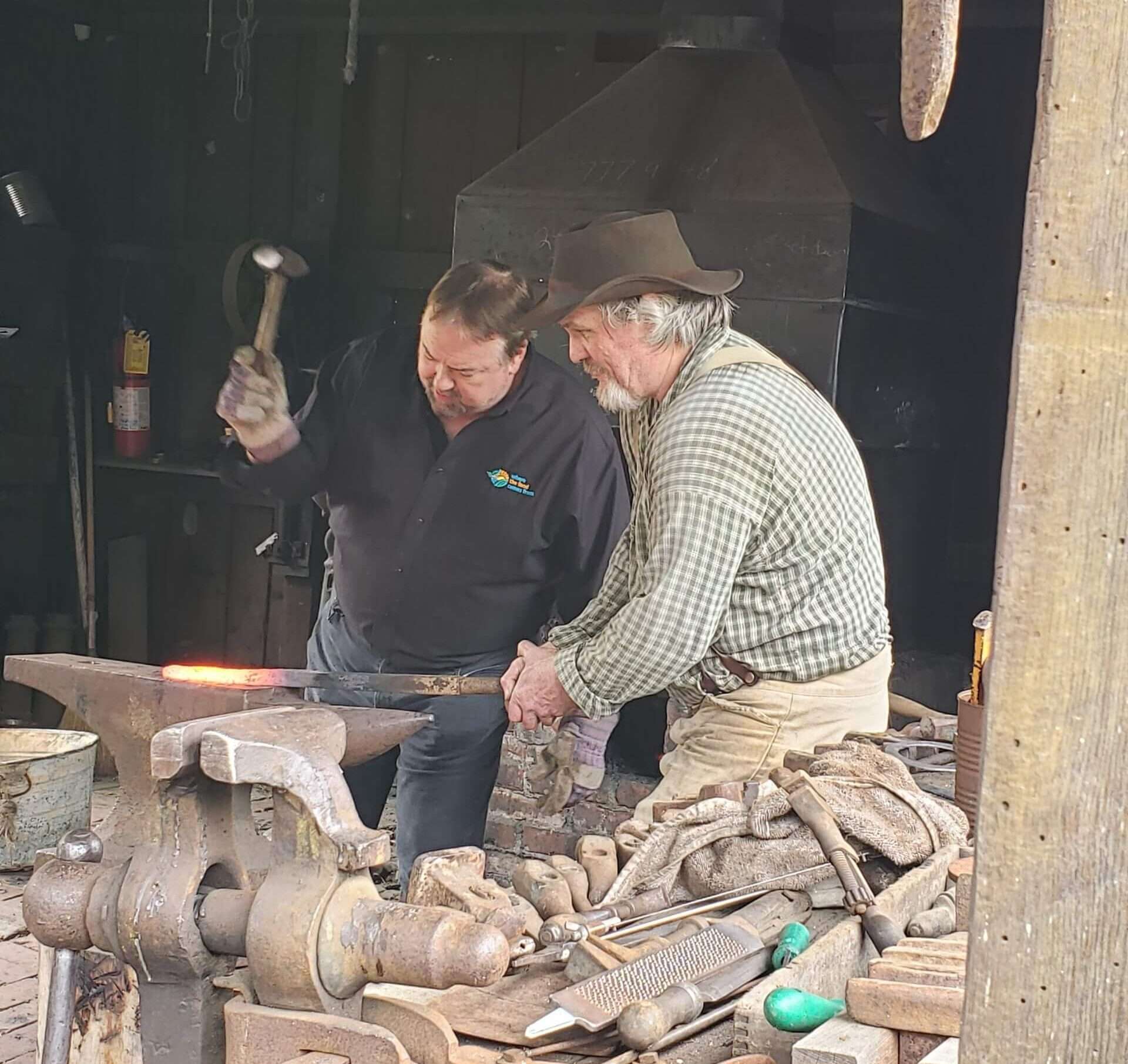 Chip and Greg working in the Blacksmith's shop. 