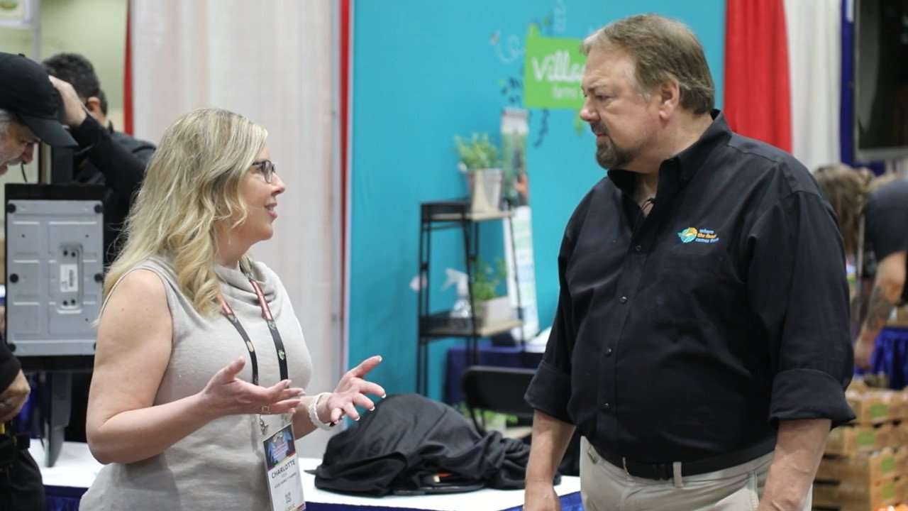 Chip on SEPC show floor talking with Charlotte Vick of Vick Family Farms