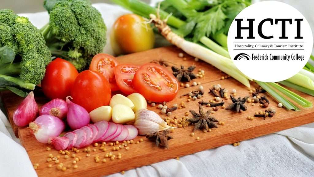 Vegetables and spices on cutting board.