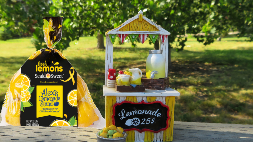 Package of Seald sweet lemons next to lemonade stand.