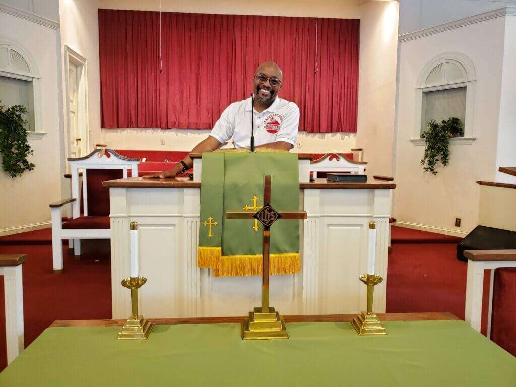 Pastor Robert J. Yarbrough at the lectern in his church, St. Mark AMA