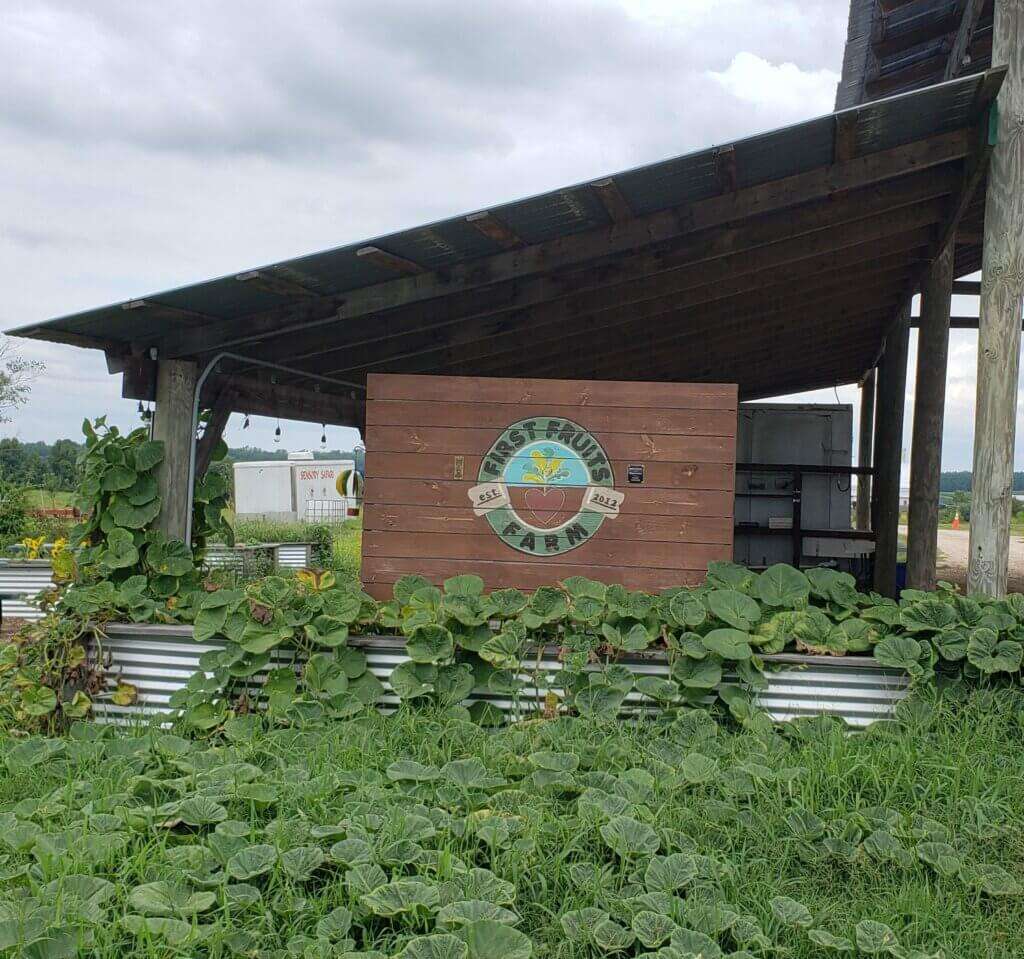 First Fruits Farm sign. 