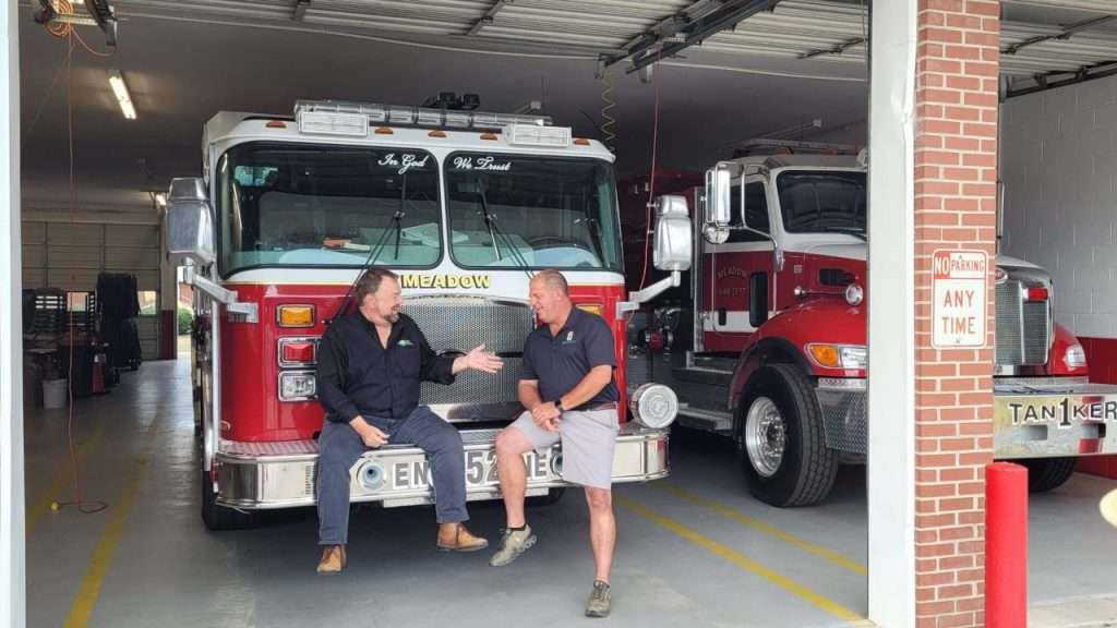 Chip Carter and Assistant Fire Chief Mike Wood laughing.