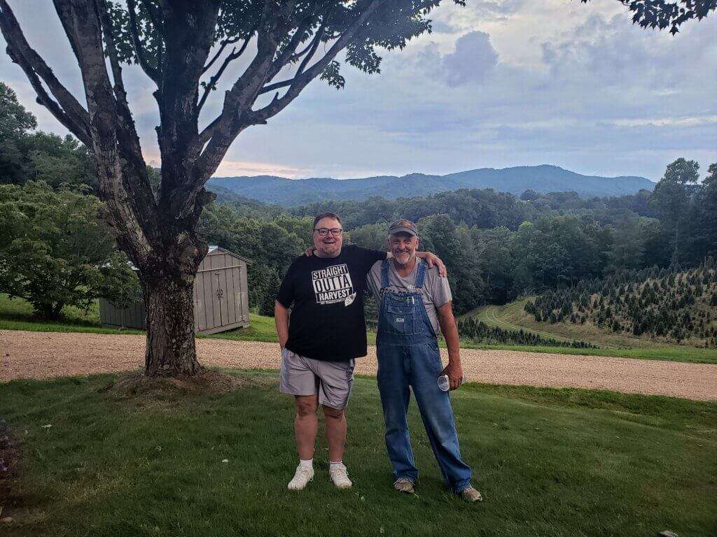 Larry and Chip with mountains in the background.