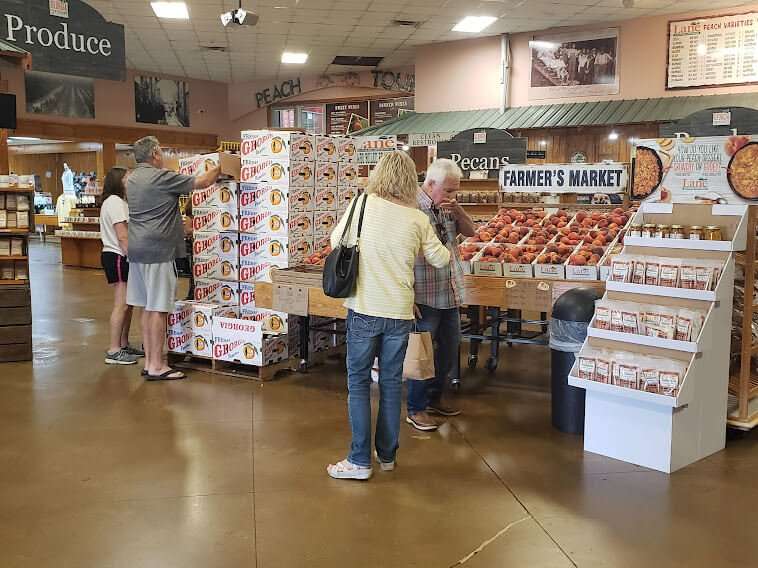 Woman browses in Lane Southern Orchards retail store.