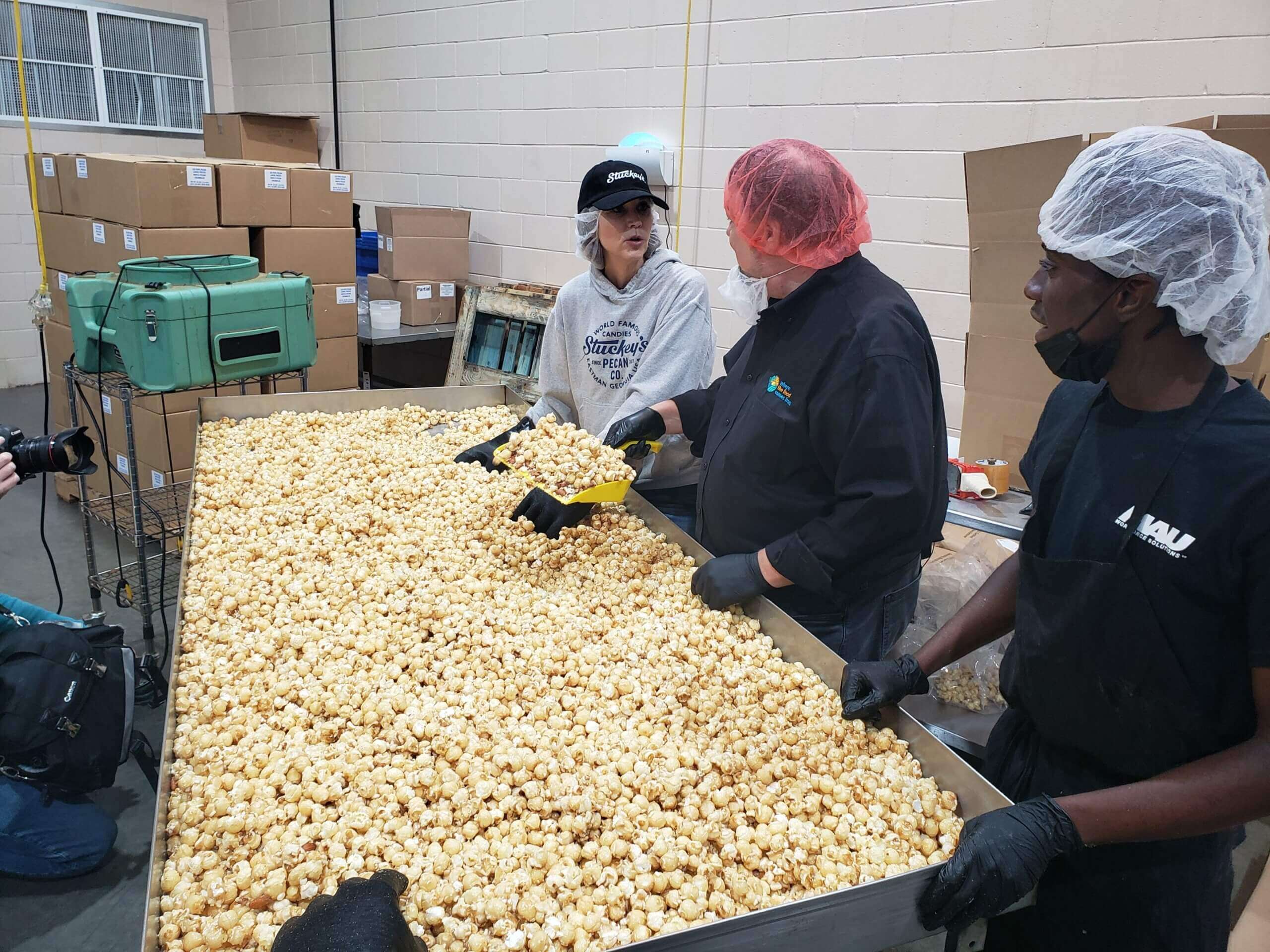 Stephanie, Chip and crew at popcorn prep station. 