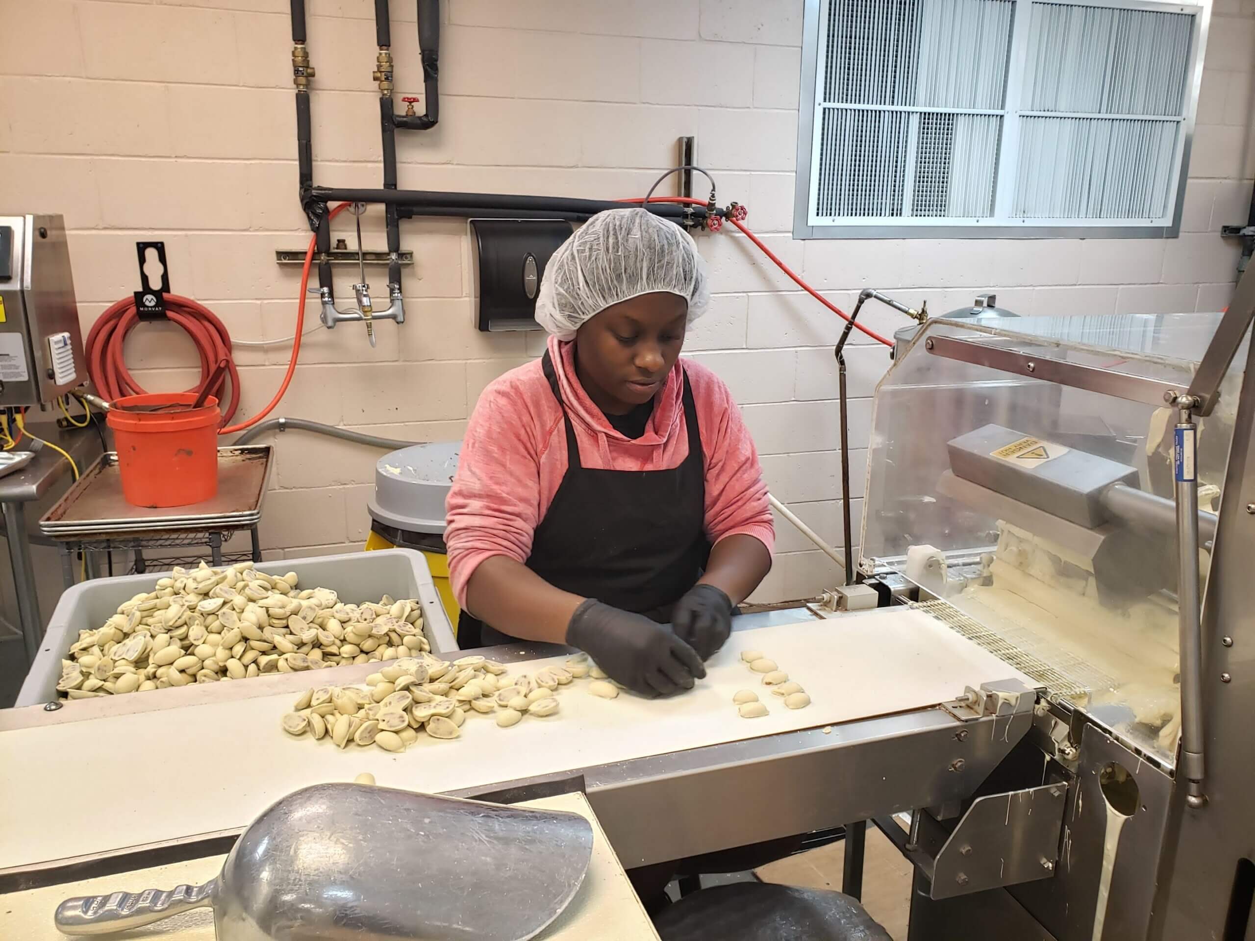 Stuckey's employee preps white-chocolate covered pecans.