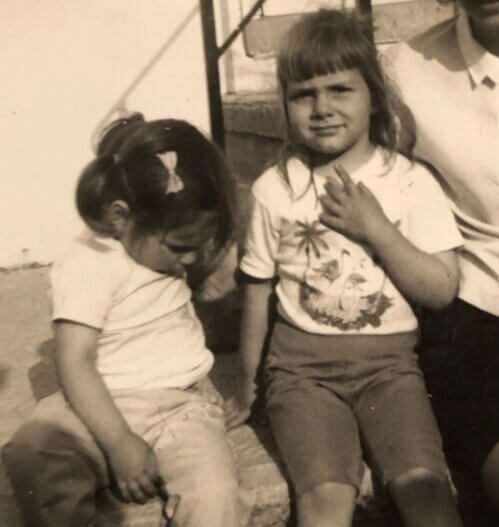 Donna and sister as kids on vacation. 