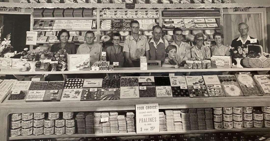 Old photo of family working inside the Stuckey's store. 