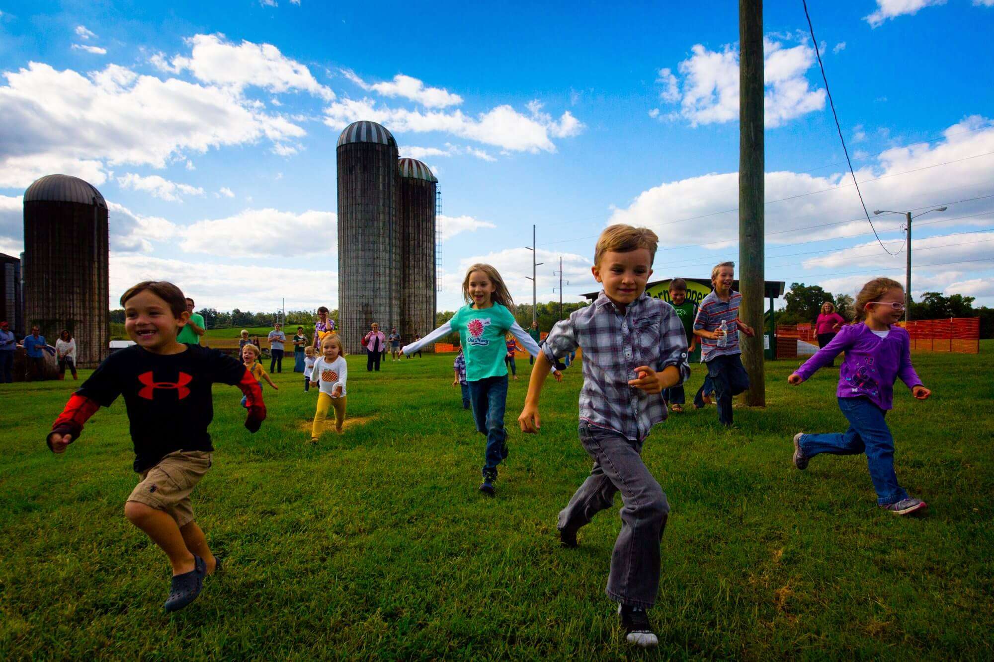 Stock image of children playing on a farm.