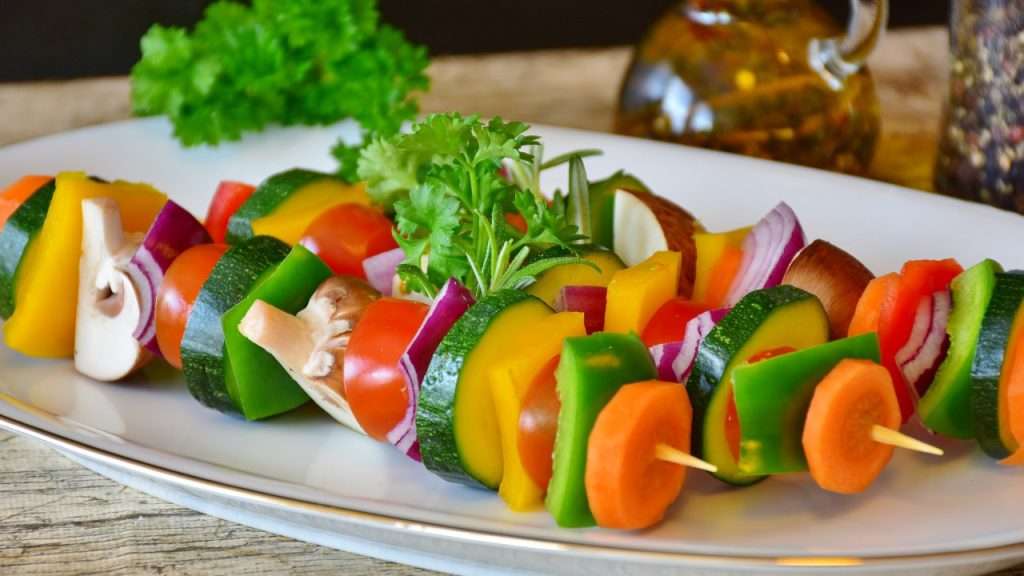 Assorted vegetables on skewers.