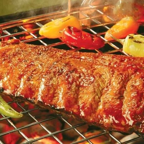 Fire-Cracker Pork Spareribs on open flame grill.