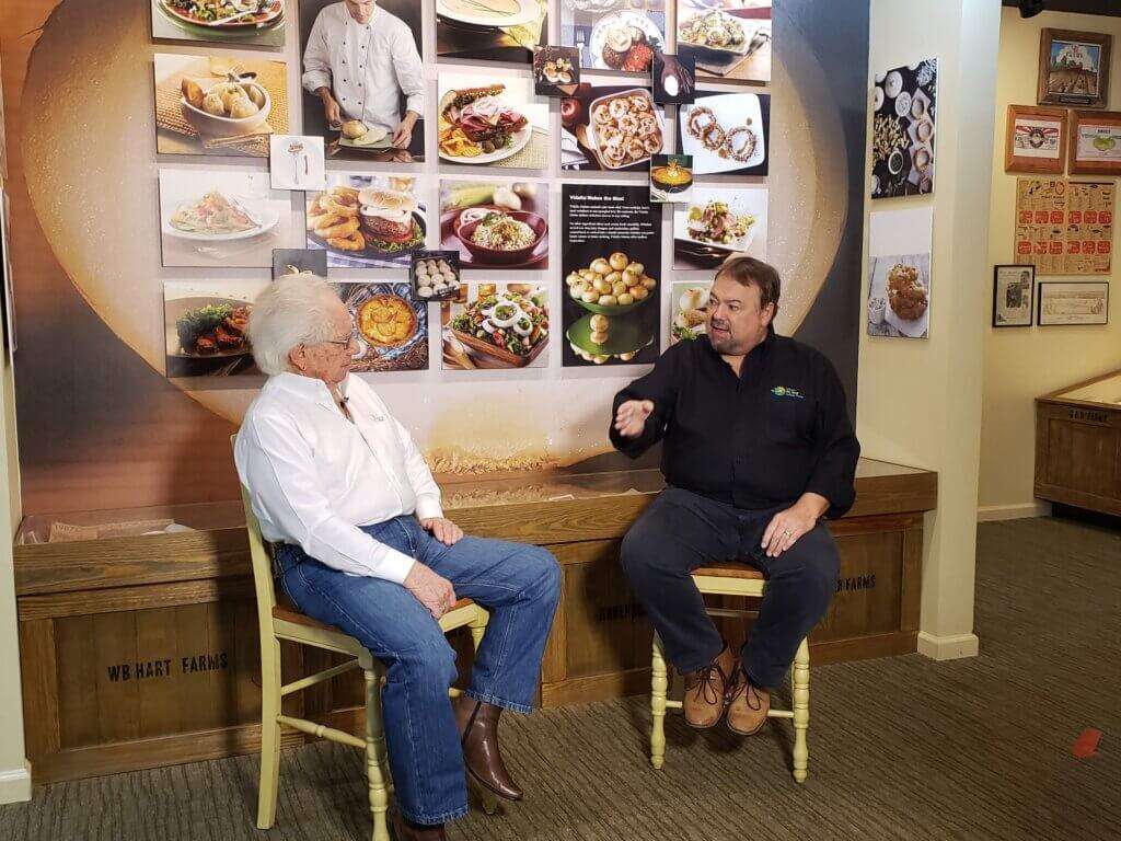 Chip and Bob Stafford sitting in chairs chatting. 