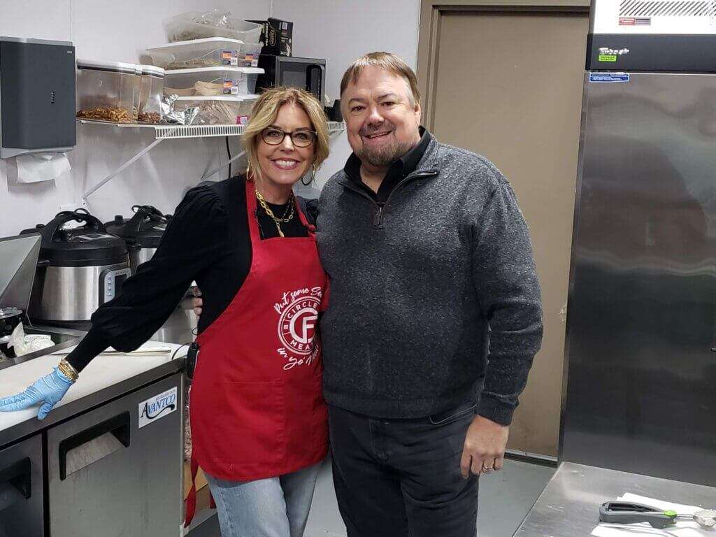 Tamela Folsom and Chip in the kitchen. 