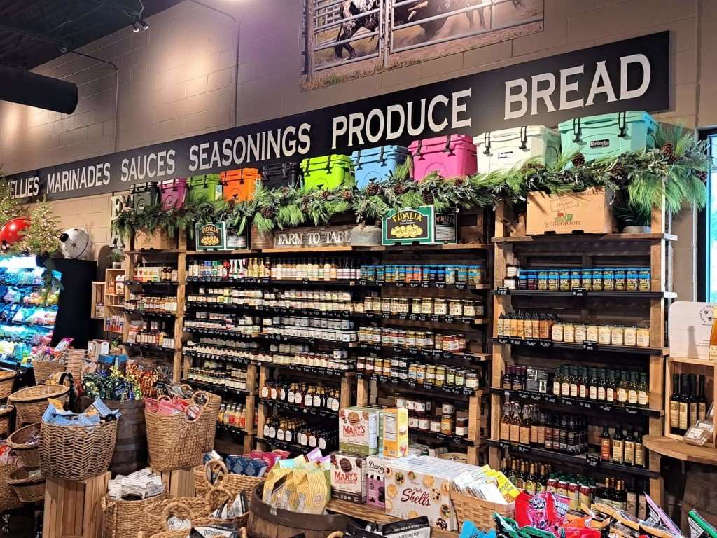 Wall display of sauces, jellies, and seasonings inside Circle F Meats Market.