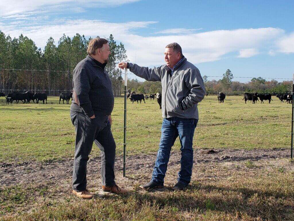 Woody Folsom and Chip Carter chatting at the pasture. 