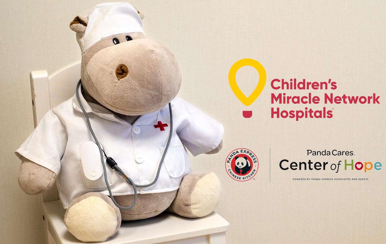 Stuffed hippo toy dressed as a doctor w/ logos for Children's Miracle Network Hospitals, Panda Express, and Panda Cares Center of Hope logo.