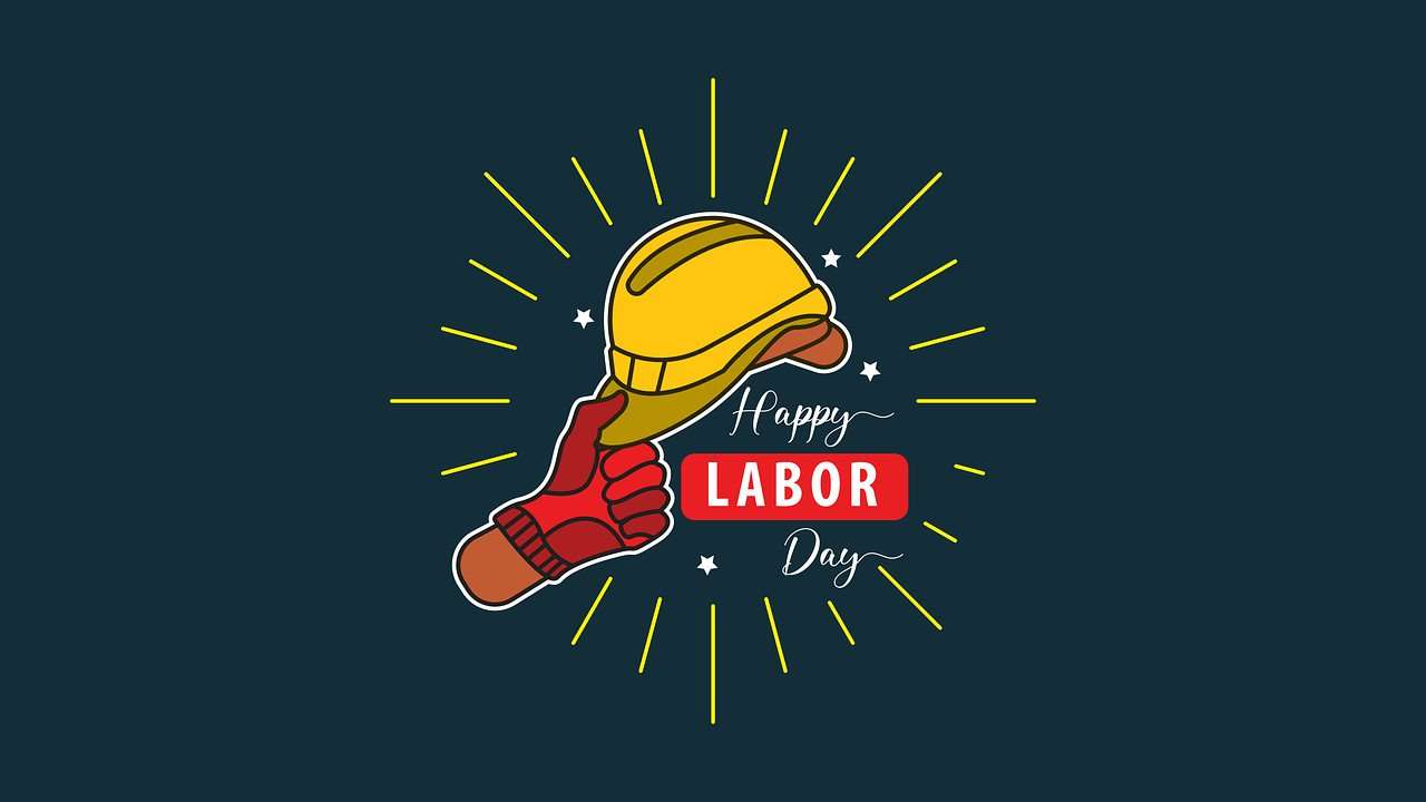 Graphic depicting a hand wearing a work glove on holding a hard hat and the words 'Happy Labor Day'