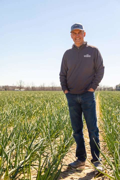 John Shuman, CEO of Shuman Farms standing in one of his Vidalia onion fields. 