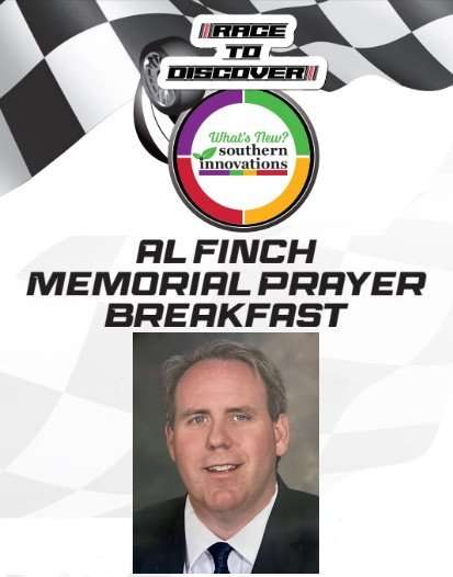 Headshot of Al Finch on a sign for his memorial breakfast. 