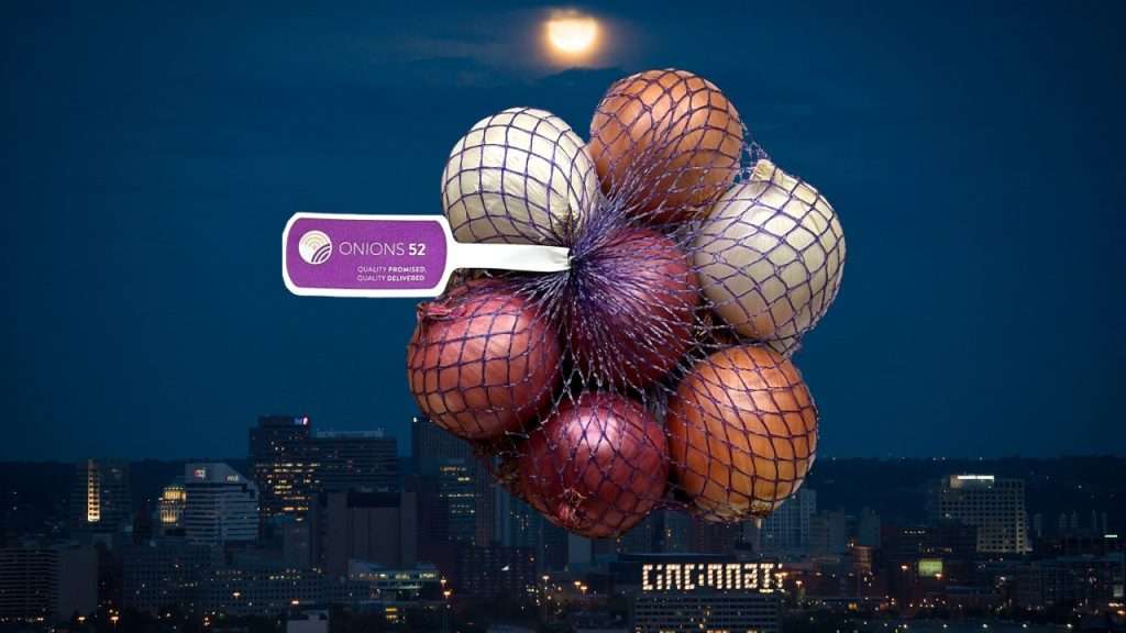 Image of Cincinnati at dusk with a labeled bag of Onions 52 onions.