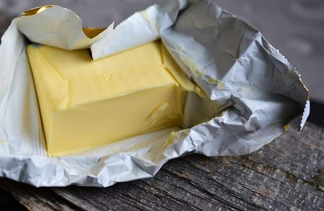 Package of open butter.