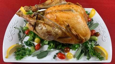 Turbo Trusser oven roasted turkey on serving platter.