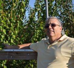 Dr. Jose X. Chaparro, Associate Professor of Horticultural Sciences at the University of Florida, in a field. 