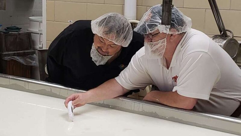 Clemson University Chip and Anthony Pounders monitoring milk temperature.