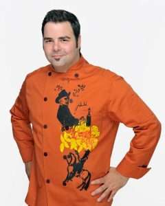 Chef George Duran in orange jacket.