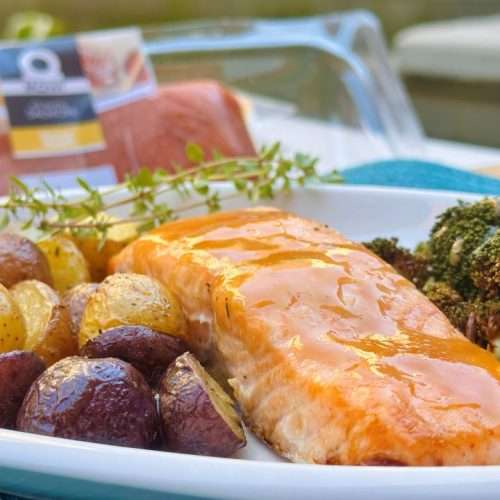 Salmon with a honey coating, potatoes, and broccoli.
