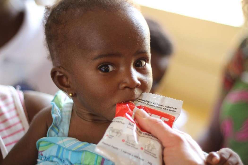 Infant eating nutrition packed food from Mana Nutrition.