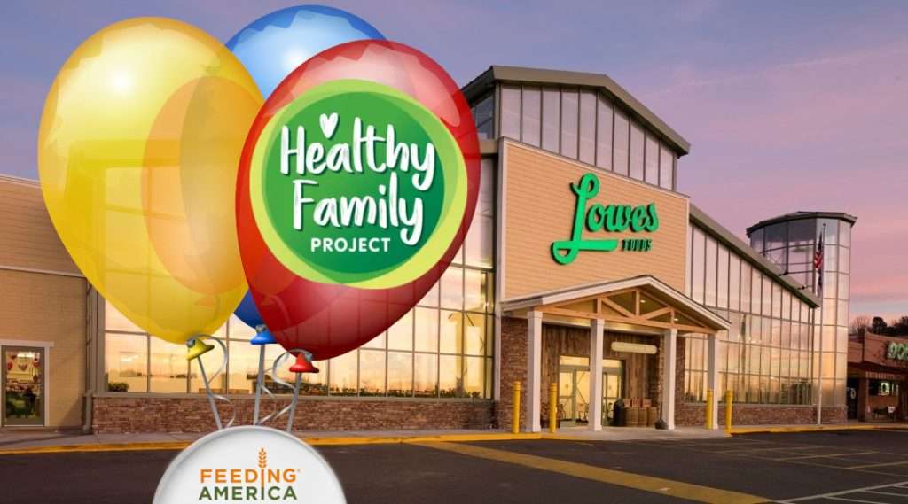 Lowes Foods storefront with Healthy Family Project balloons anchored to a Feeding America Box