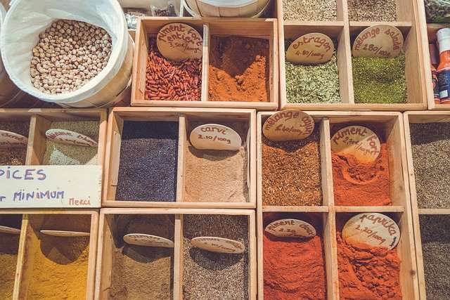Multiple types of spices in a divider box.
