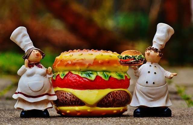 Animated image of female and male chefs with hamburgers.