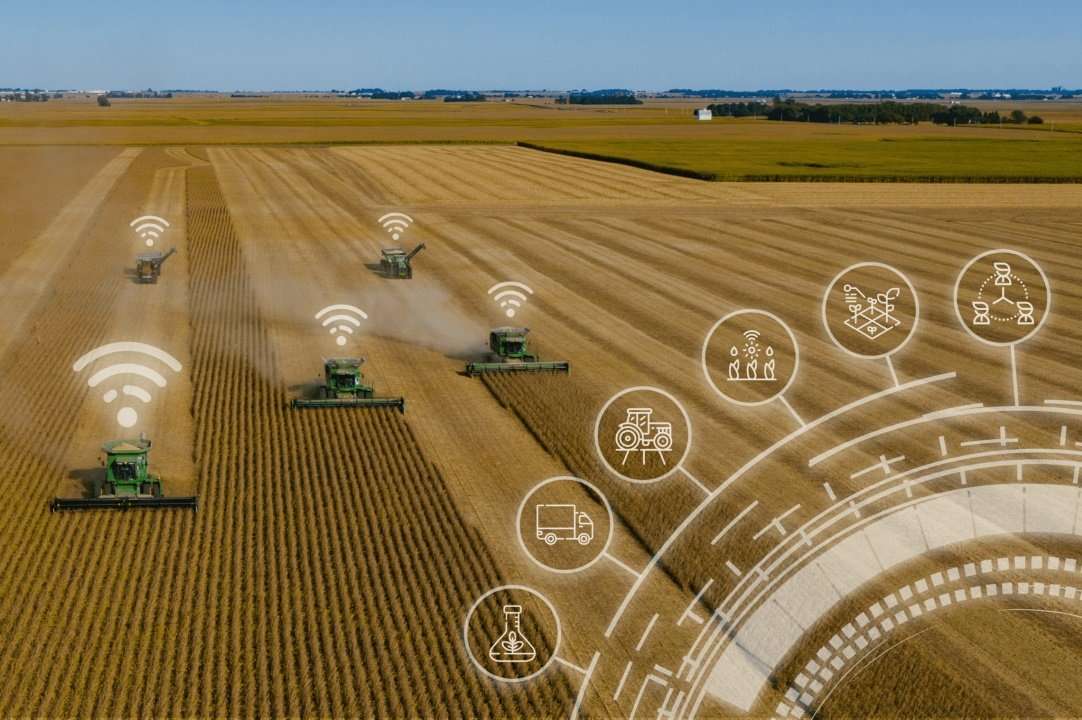 Graphic showing digital connection between farm equipment and cloud services.