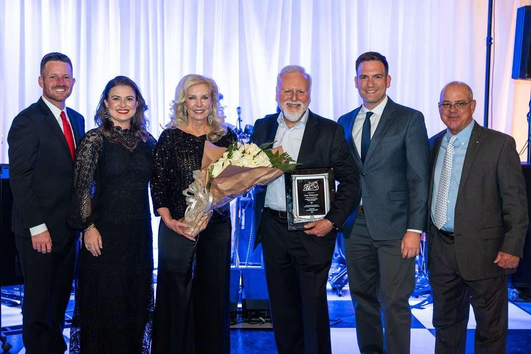 On stage at Florida Strawberry Growers Association Hall of Fame 2023 Event, Gary Wishnatzki inducted. Group Photo (L-R) Jake Rayburn, Candace Harrell, Therese Wishnatzki, Gary Wishnatzki, Nick Wishnatzki, Kenneth Parker