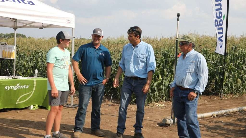 Weston Hannon, Jay, Glenn McKay, Doug Plaisted standing at the corn research farm.