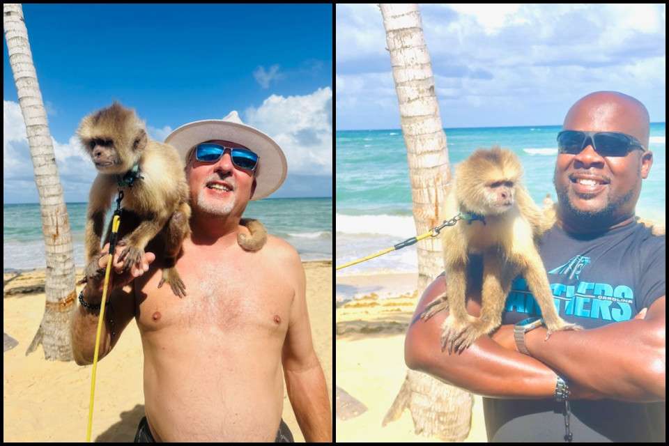 Mike Roberts and Gary Baker on an island with a monkey.