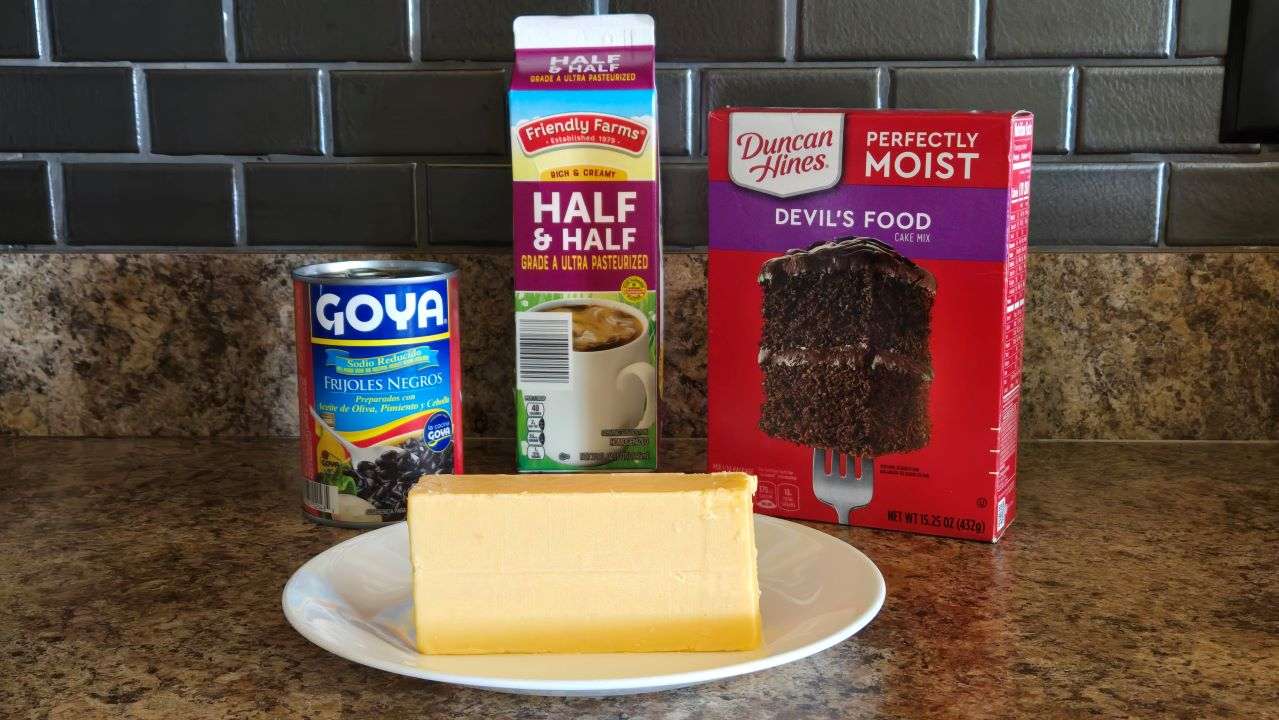 Cheese, soup, half & half, and cake mix on kitchen counter.