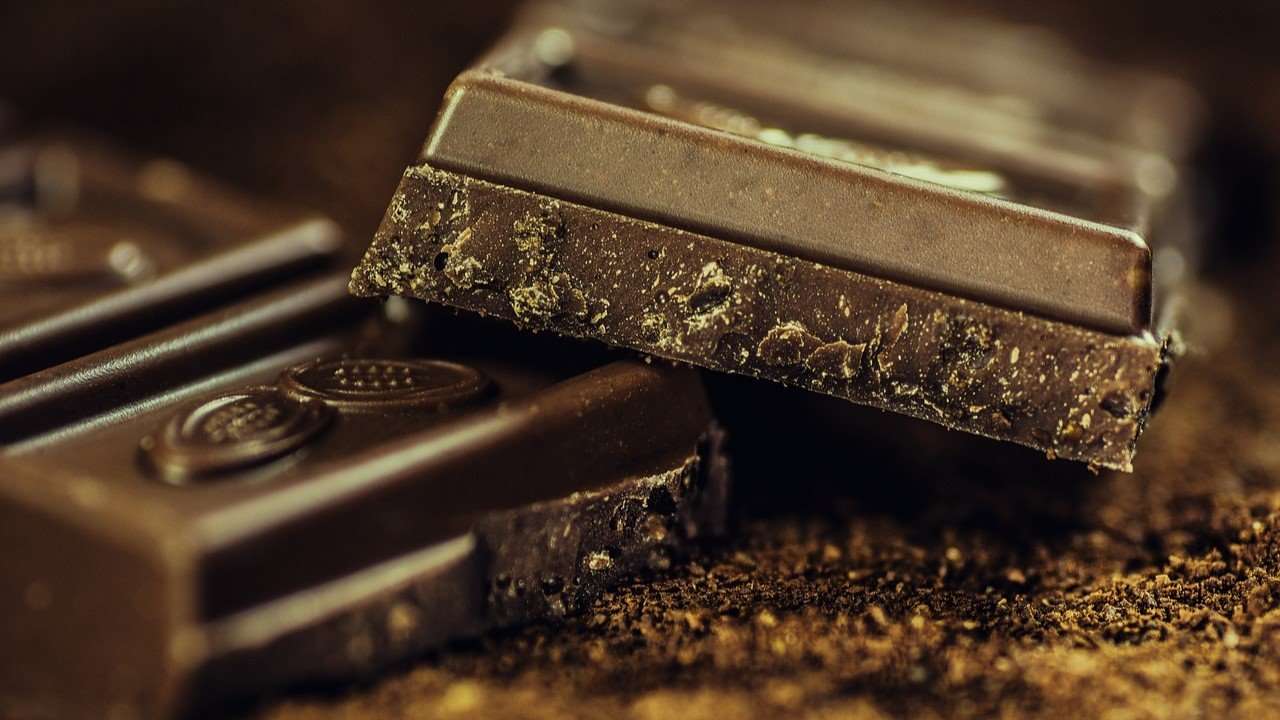 Macroimage closeup of a chocolate bar split in half.