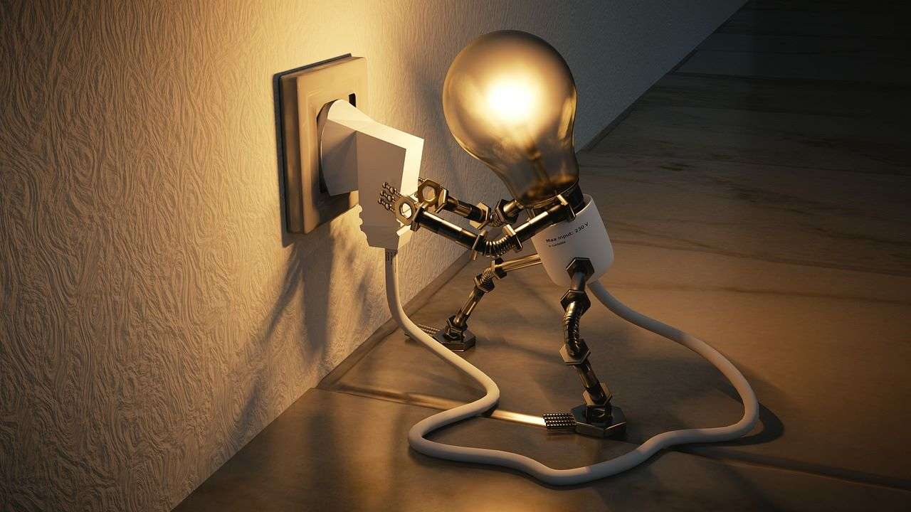 Lightbuld with human features plugging in a lamp. 