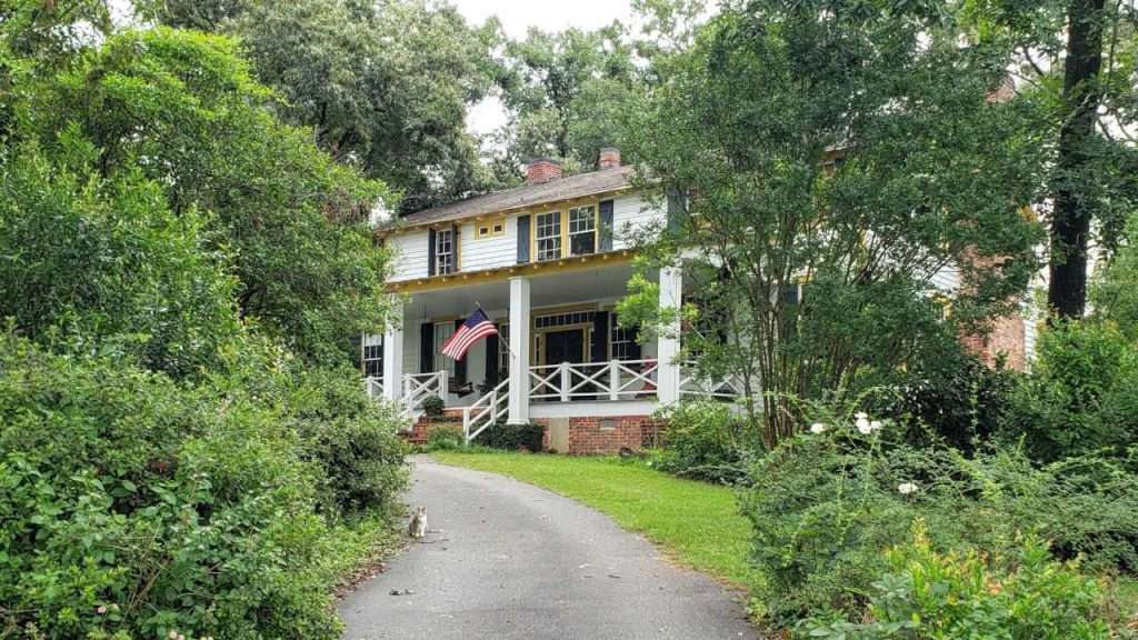 Bradford farm house with American flag out front.