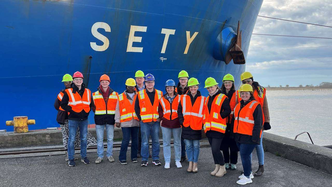 An Iowa State University agricultural business class studying the supply chain for soybeans visiting the AGP soybean meal port facility in Grays Harbor, Washington. Credit: Bobby Martens