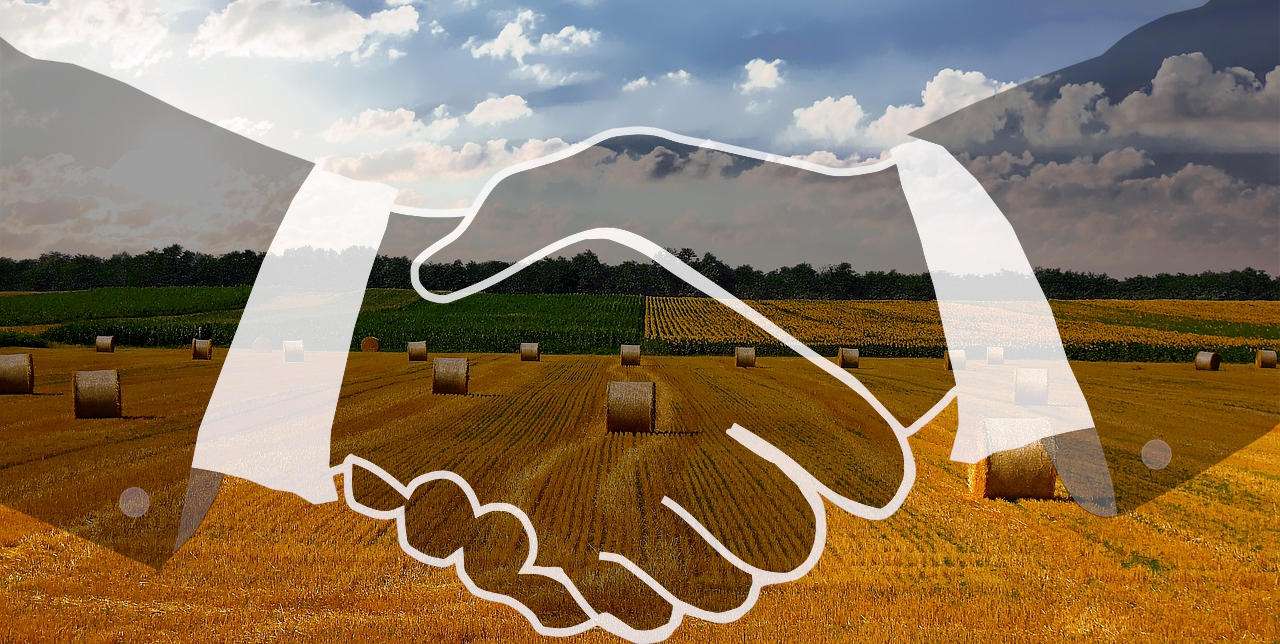 Image of a farm with a handshake overlay.