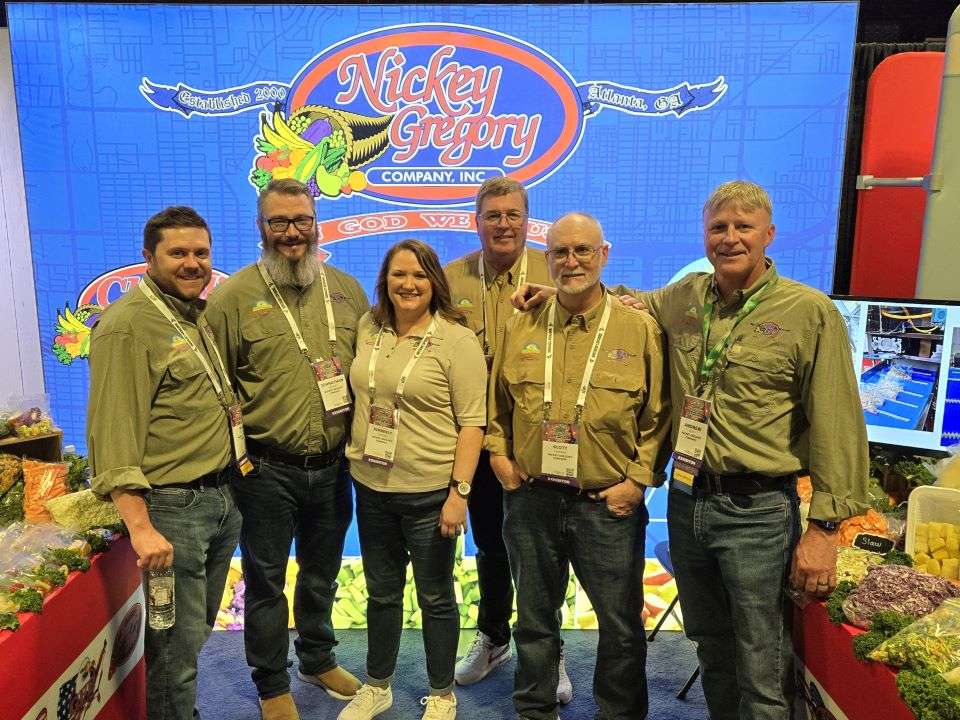 Blare Greenhill, Johnathan Gregory, Kimberly Gregory, Nickey Gregory, Scott Chapman and Andrew Scott, Nickey Gregory Company in booth at convention center.